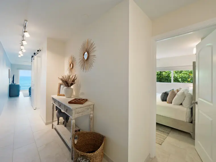 Entry hallway with console table and view into bedroom