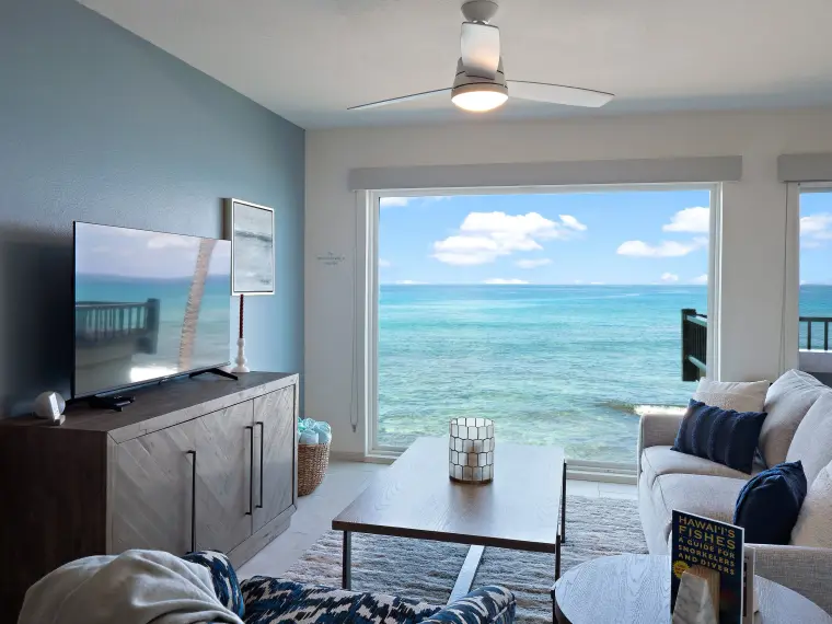 Living room with ocean view through picture window
