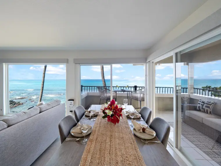 Dining table with tropical flowers and panoramic ocean view