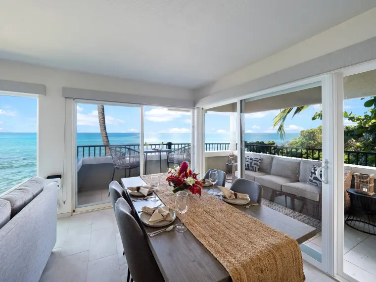 Dining area with wraparound lanai and ocean on both sides